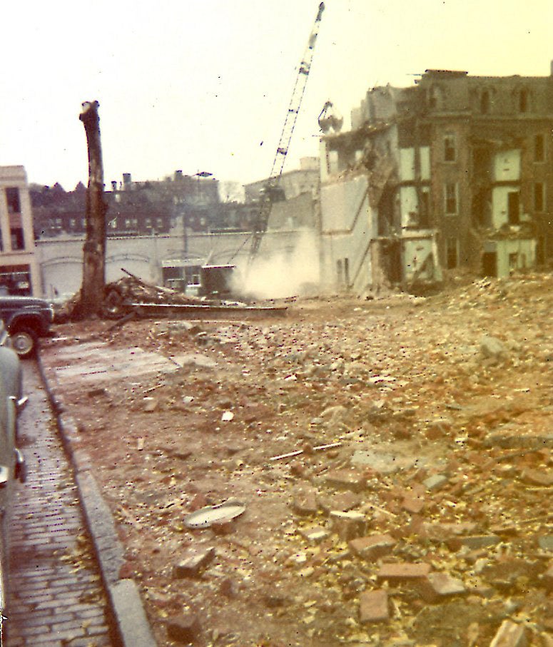 East side of 200 block of South McAlpin Street, 1960, showing land recently cleared on McAlpin Street and demolition-in-progress on the south side of 3600 Walnut Street. In the background are the buildings on the north side of Walnut Street, the three-story 3625 Walnut Street at the extreme left margin and the one-story, commercial garages at 3613-23 Walnut at center left.