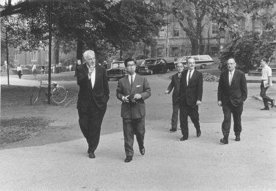 Japanese Royal Family's informal visit to the Penn campus: President Gaylord P. Harnwell walks across College Hall green with Prince Mikasa, 1965