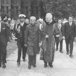 Indian President Sarvepalli Radhakrishnan and Penn President Gaylord P. Harnwell walking across the Penn campus with security detail and others, 1963