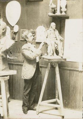 Sculptor John J. Boyle working on statue of Benjamin Franklin, 1898